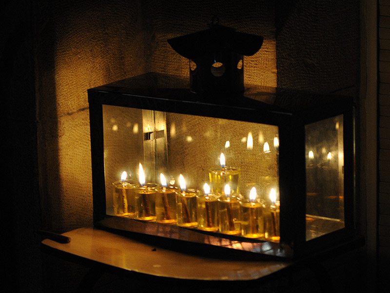 A Hanukkiah on display in the window of a home in Jerusalem’s Mea Shearim neighborhood